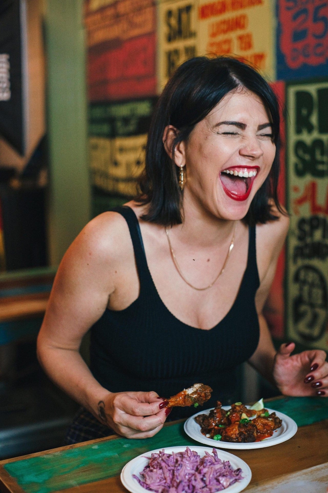 girl laughing, having a great time at rudies restaurant