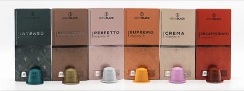 4 sets of coffee machine pods and their packaging behind them 