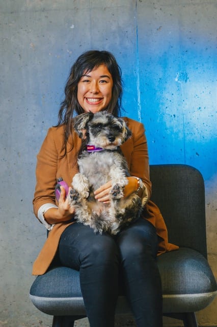 Pui-Ming from Perfocal holds a dog and smiles happily