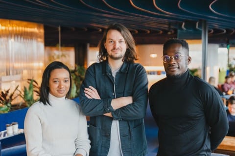 a young team in a tech startup are smartly dressed and ready to go