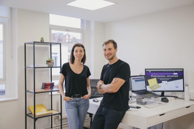 Team of two at a multivitamins company pose in their new west london office for their perfocal photoshoot