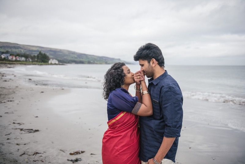 Man holds his fiancé's face after just proposing at a perfocal engagement photoshoot