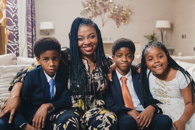 family portrait of mother and 3 children at home