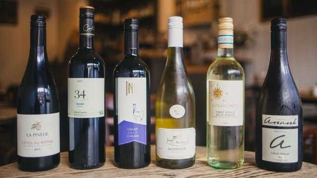 a line up of the best vintages, a mixture of bottle sizes and colours, dark and light an