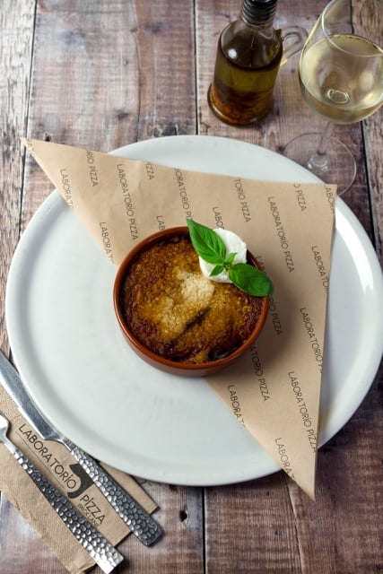 singular sugar glazed apple tart topped with creme fresh and mint