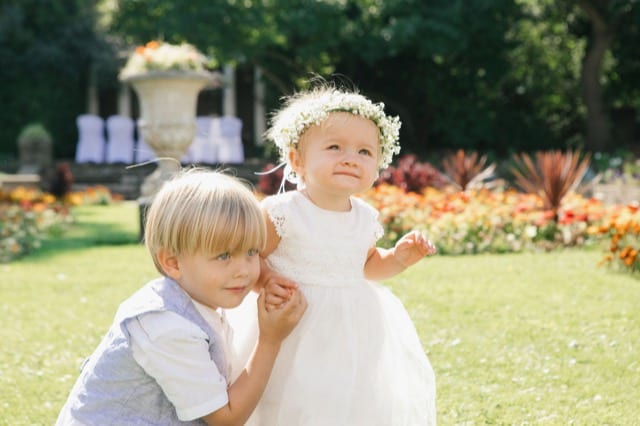 two blonde children playing at a party