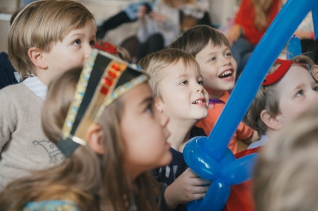 children interacting with kids entertainer on a birthday party