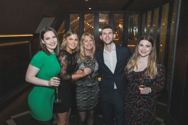 friends toasting on a birthday party in a club