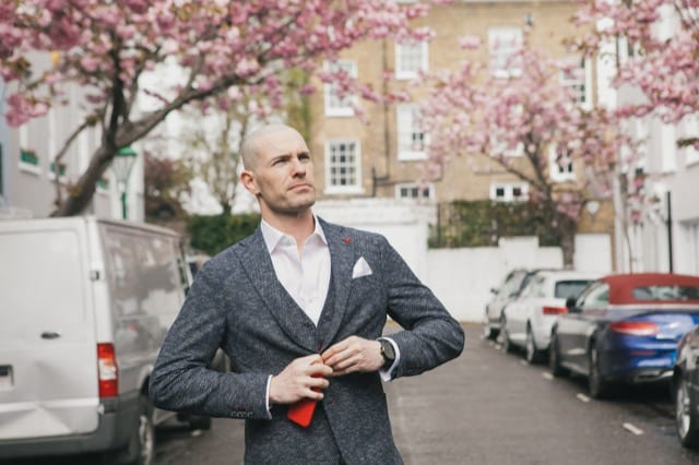 man in blazer posing for his social profile photoshoot