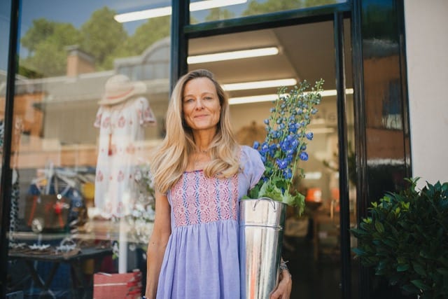 woman holding flowers posing for personal portrait shoot