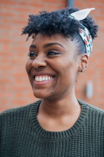 woman smiling as doing her portrait photos with a Perfocal photographer