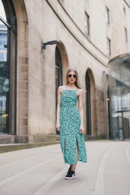 female influencer posing outside Manchester Library for photoshoot