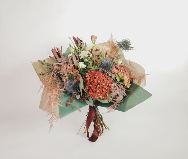 professional product photography of a luxury green leather handbag