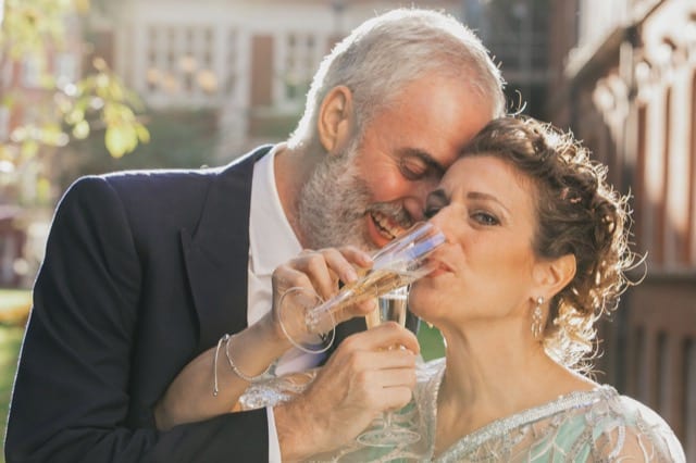 couple sharing champagne at a wedding ceremony