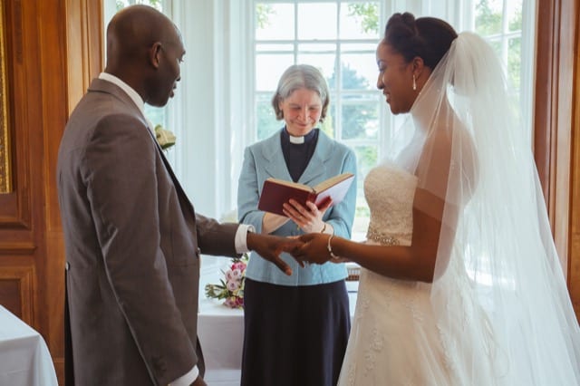 Black couple exchanging vows on a wedding