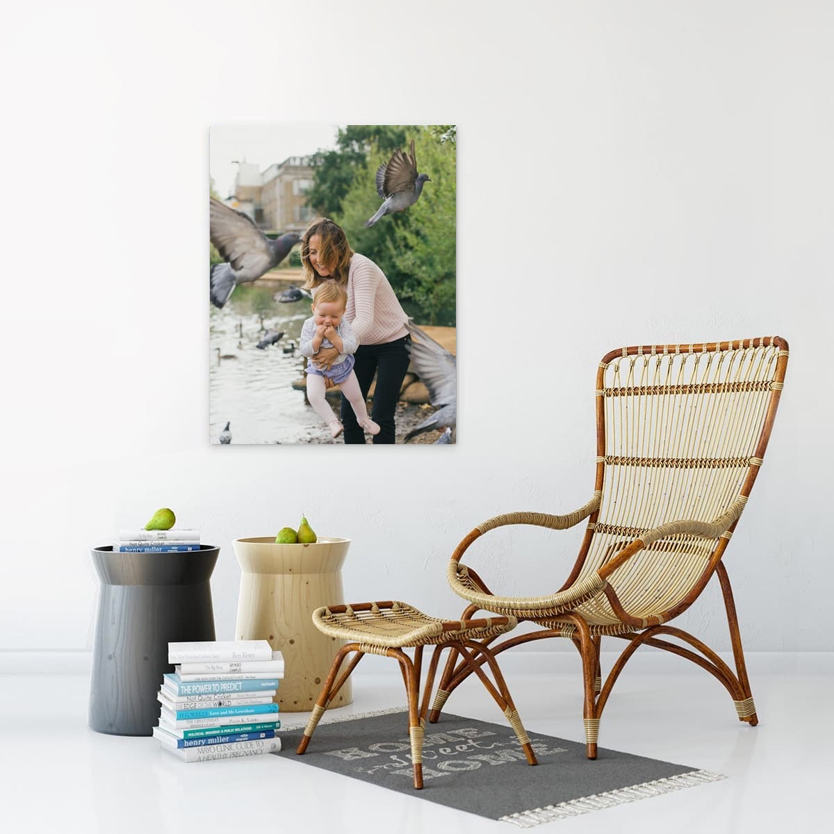 wall mounted printed frame in room with chair and books